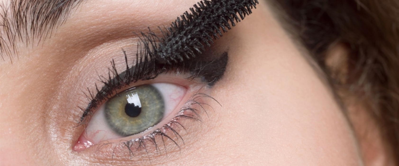 A close up photo of painting eyelash