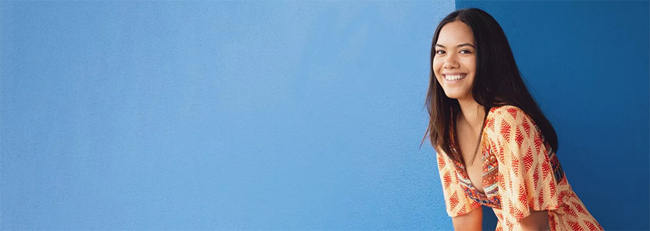 A smiling woman on a blue background