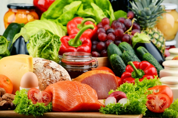 A table full of food, vegetables and meat